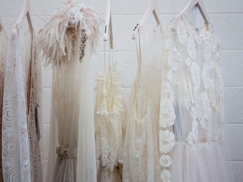 Neatly organised closet transitioning from winter to spring.