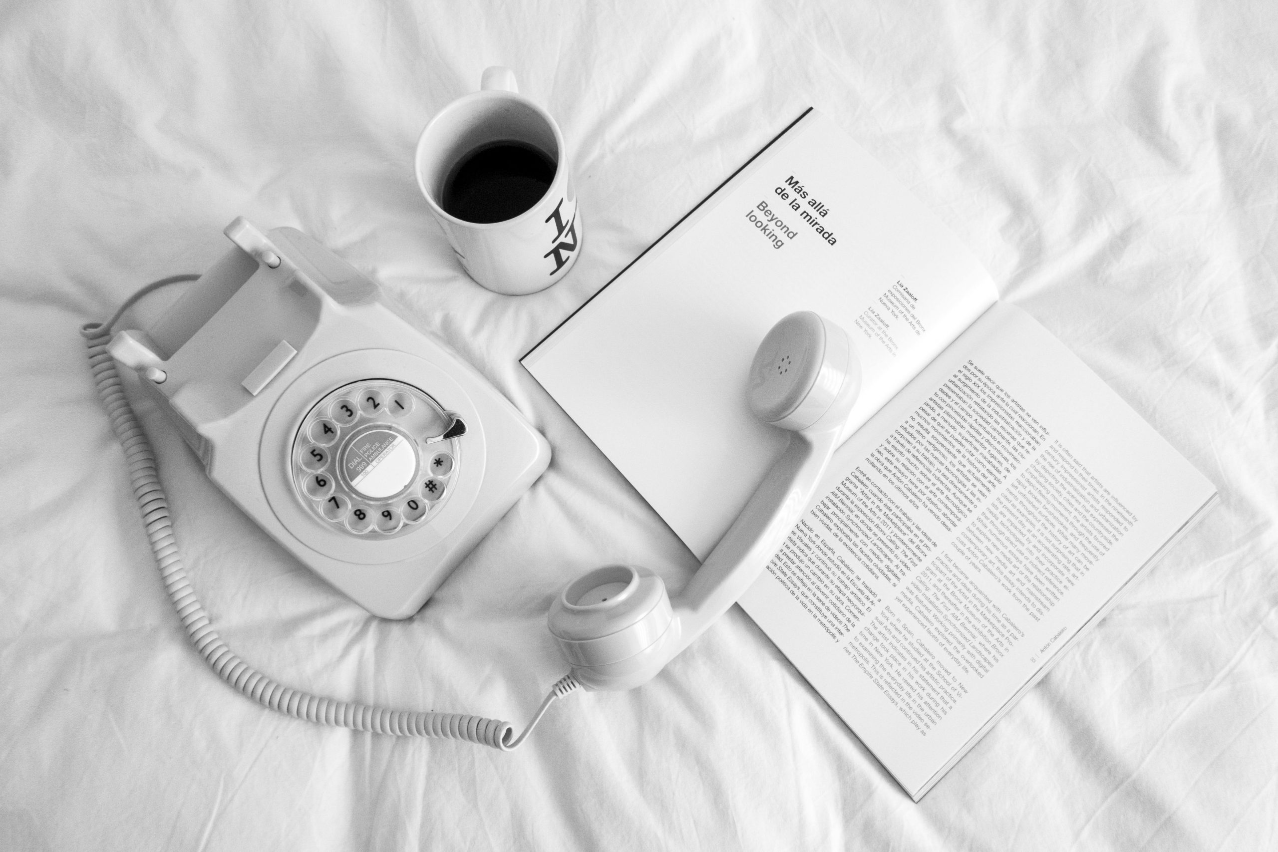 A situation showing a phone on a bed.